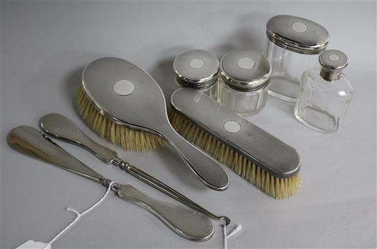 An eight-piece silver-mounted part dressing table set.